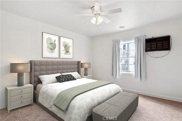 bedroom featuring light carpet, ceiling fan, and baseboards