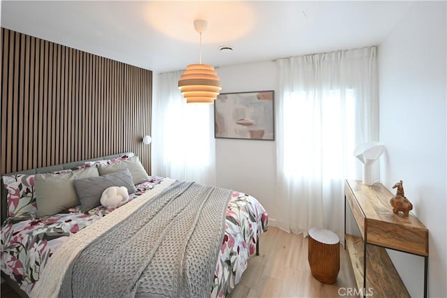 bedroom with light wood finished floors