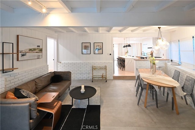 living area with beam ceiling