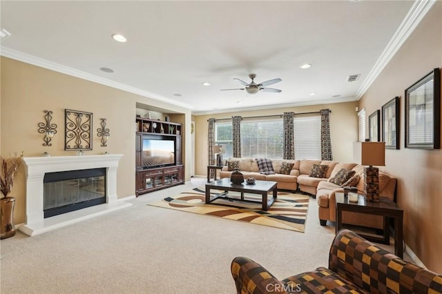 carpeted living area with a glass covered fireplace, recessed lighting, visible vents, and ornamental molding