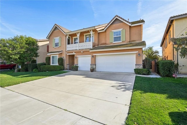 view of front of property with stucco siding, driveway, a front yard, and an attached garage