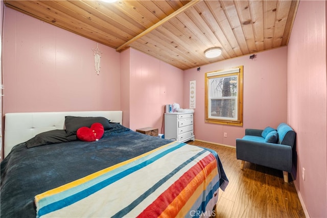 bedroom featuring wood ceiling and wood finished floors