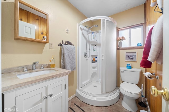 full bath with toilet, a stall shower, and vanity