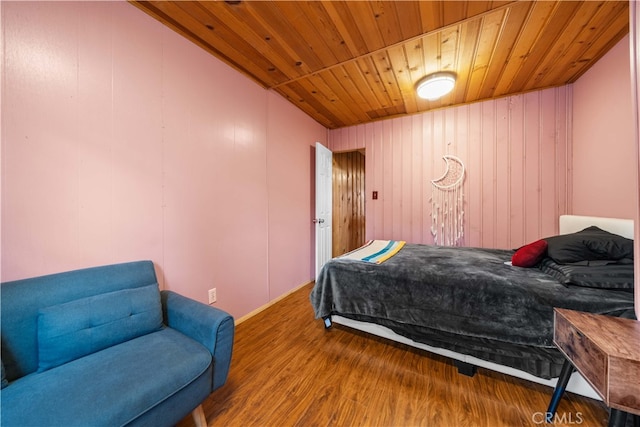 bedroom featuring wooden ceiling and wood finished floors