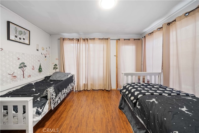 bedroom with wood finished floors