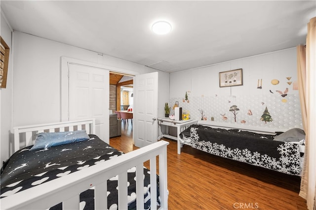 bedroom with wood finished floors