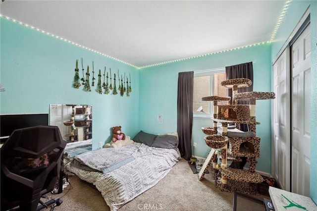 bedroom with carpet floors and a closet