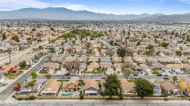 birds eye view of property with a residential view and a mountain view