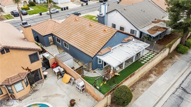 birds eye view of property with a residential view