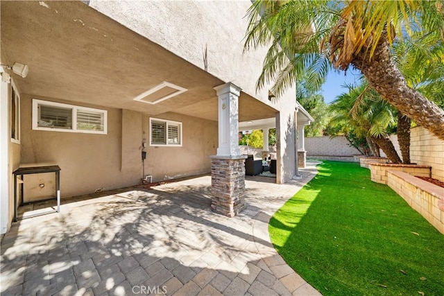 view of patio / terrace featuring fence