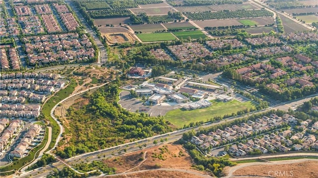 birds eye view of property with a rural view