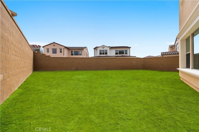 view of yard featuring a fenced backyard