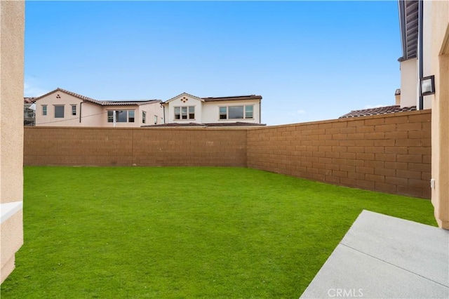 view of yard featuring a fenced backyard