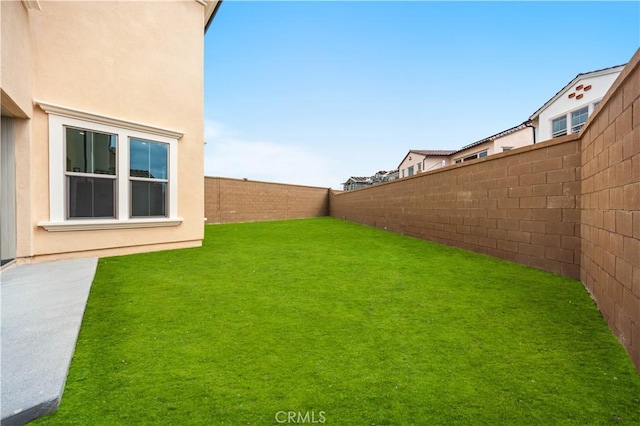 view of yard featuring a fenced backyard