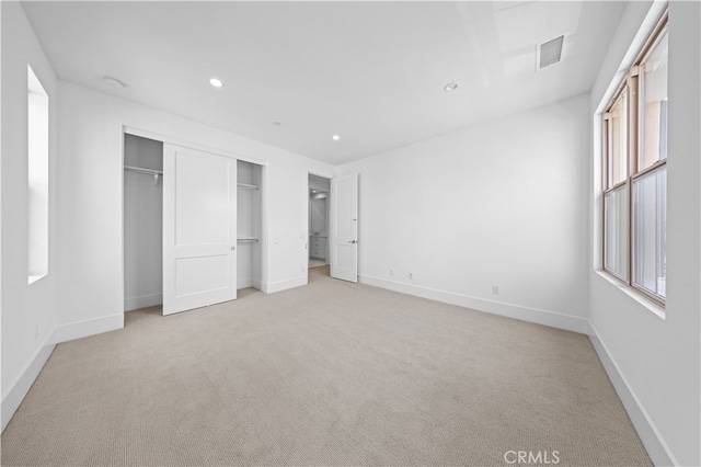 unfurnished bedroom featuring recessed lighting, a closet, visible vents, and baseboards