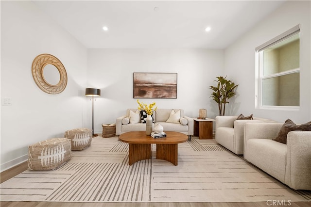 living room featuring recessed lighting and baseboards