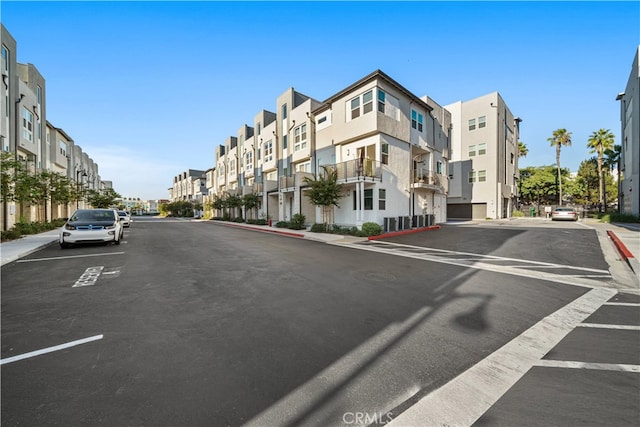 view of road with sidewalks and curbs