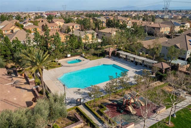 view of swimming pool with a residential view