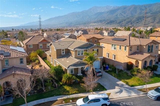 drone / aerial view with a residential view and a mountain view