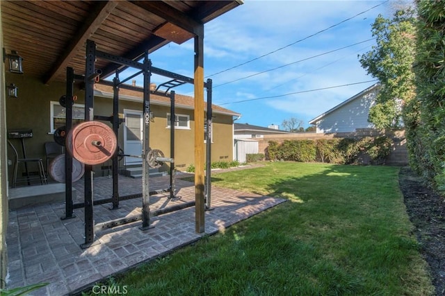 view of yard featuring a patio and fence