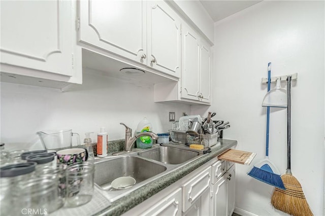 kitchen featuring white cabinetry