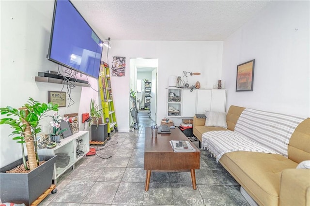 living area featuring a textured ceiling