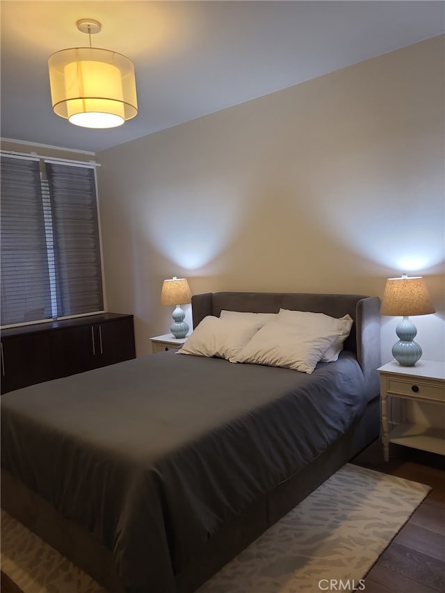 bedroom featuring wood finished floors