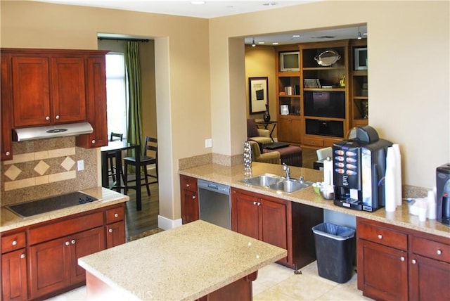 kitchen featuring light stone counters, backsplash, stainless steel dishwasher, under cabinet range hood, and black electric cooktop