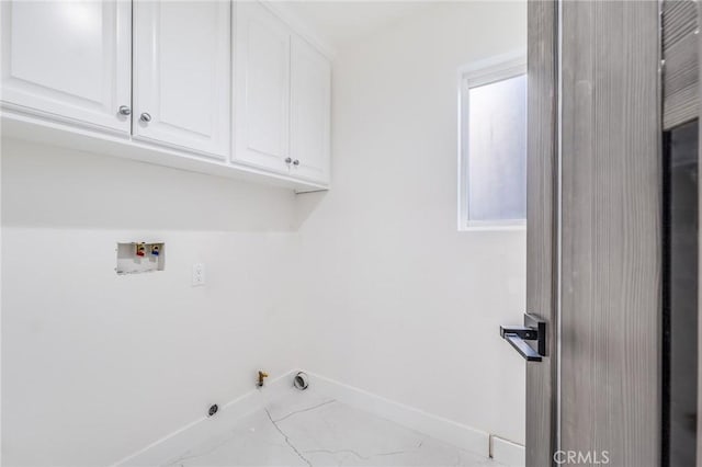 laundry room with cabinet space, hookup for a washing machine, baseboards, and hookup for a gas dryer