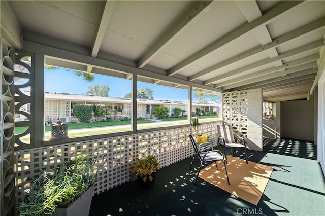 sunroom with beam ceiling