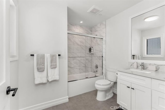 bathroom featuring visible vents, toilet, combined bath / shower with glass door, vanity, and baseboards