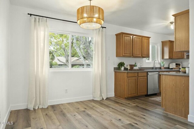138 S Bryn Mawr St Unit 40, Ventura, CA 93003 - kitchen with stainless steel dishwasher, plenty of natural light, and light wood finished floors