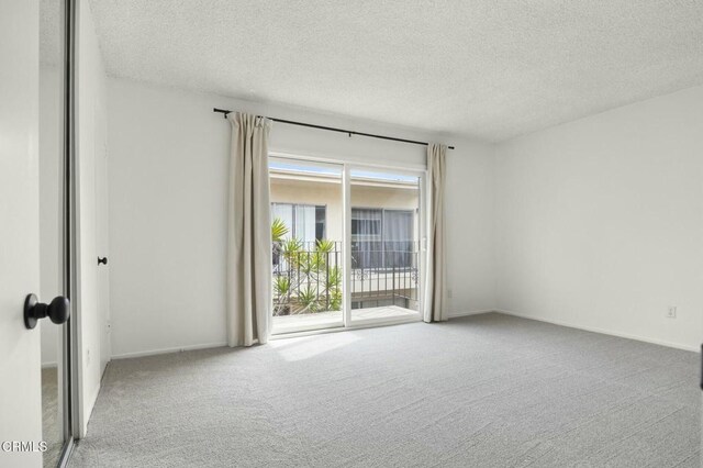 138 S Bryn Mawr St Unit 40, Ventura, CA 93003 - unfurnished room with carpet and a textured ceiling