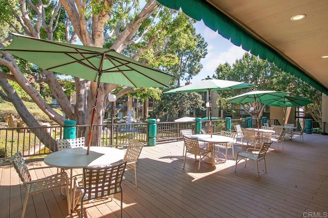 wooden deck featuring outdoor dining space