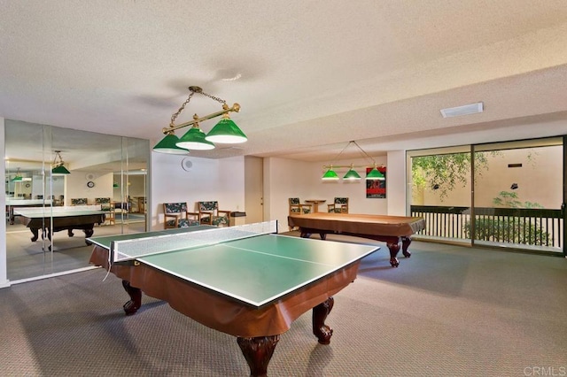 game room featuring carpet floors, pool table, and a textured ceiling