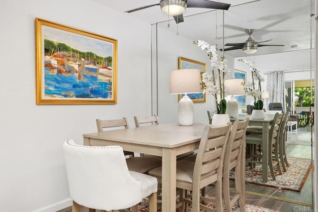 1885 Diamond St Unit 2-329, San Diego, CA 92109 - dining area featuring a ceiling fan, wood finished floors, and baseboards