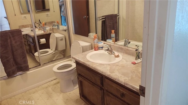 bathroom with toilet, shower / bath combination with glass door, vanity, and tile patterned floors