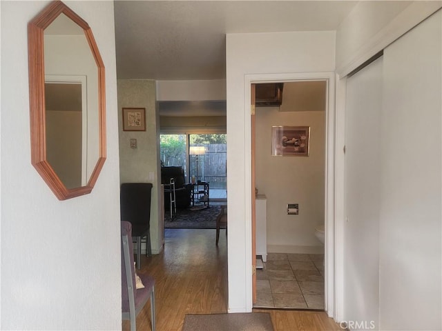 corridor featuring wood finished floors