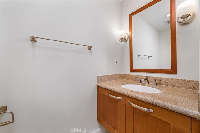 bathroom with visible vents and vanity