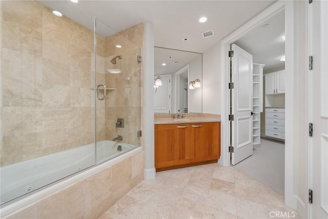 full bath with tiled shower / bath, visible vents, vanity, and recessed lighting