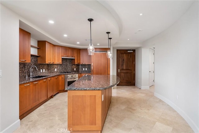 kitchen featuring decorative backsplash, appliances with stainless steel finishes, a center island, open shelves, and a sink