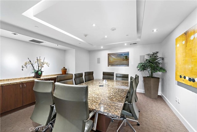 dining space with recessed lighting, a raised ceiling, visible vents, and baseboards