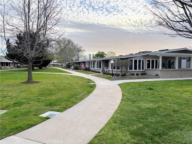 view of home's community featuring a yard