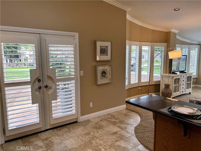 interior space with french doors, light tile patterned floors, lofted ceiling, ornamental molding, and baseboards