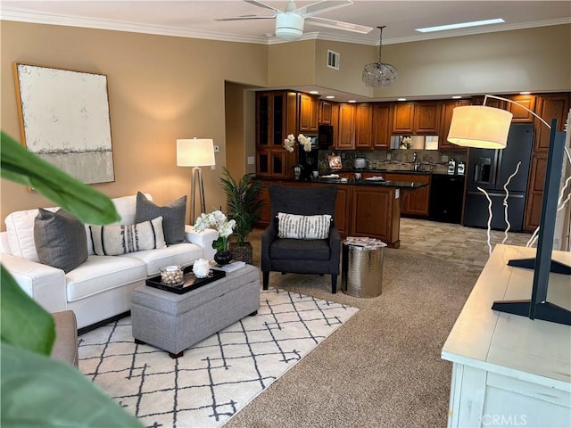 living area with light carpet, ceiling fan, visible vents, and crown molding