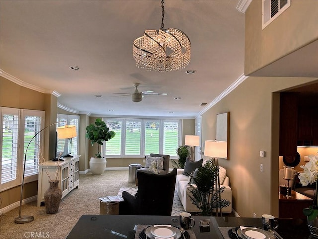 living room with visible vents, ornamental molding, carpet flooring, ceiling fan, and baseboards