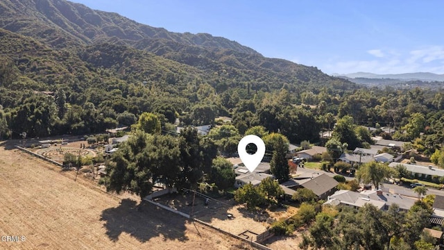 bird's eye view with a forest view and a mountain view