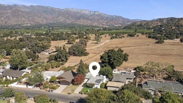 bird's eye view featuring a rural view and a mountain view