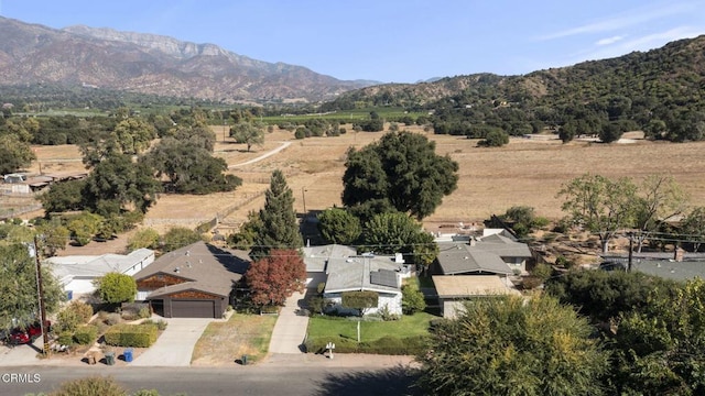 bird's eye view featuring a rural view and a mountain view