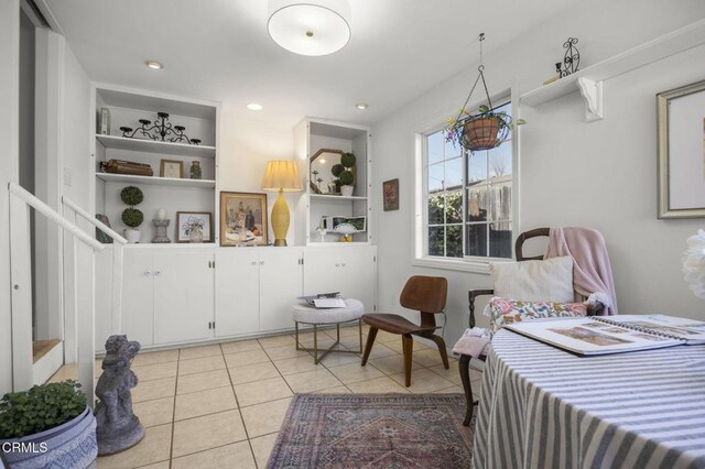 interior space featuring light tile patterned floors and built in features